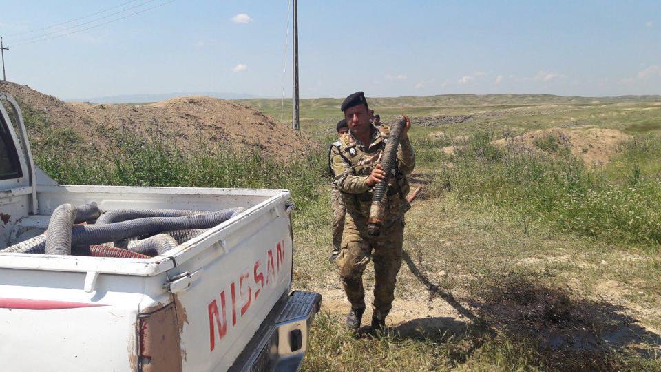 Police forces in Kirkuk confiscate two trucks in the site of an oil robbing, April 18, 2019. (Photo: Energy Police in Kirkuk)